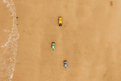 Photo of three TBug Baja VW Beetles from above