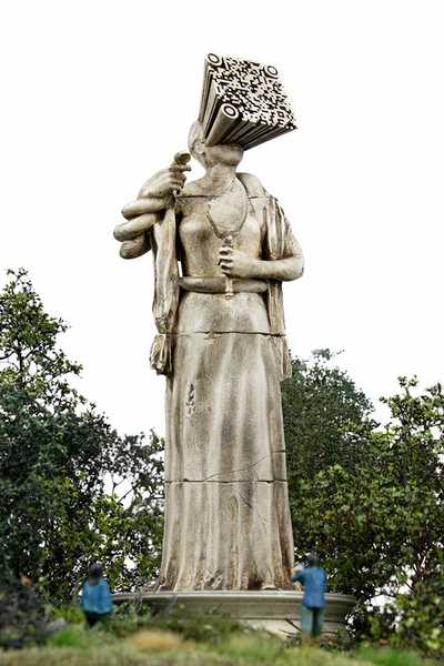 Sculpture of a QR code extruding out of a head