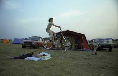 Kid jumping his mother with his bike