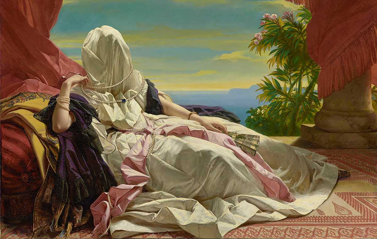 Woman lounging covered with a sheet