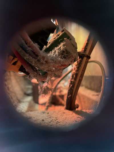 Inside an oven, ooking at electronics covered in flour