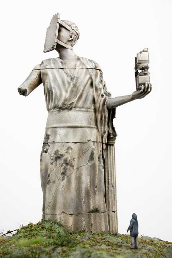 Sculpture of a woman with a phone taped to her face