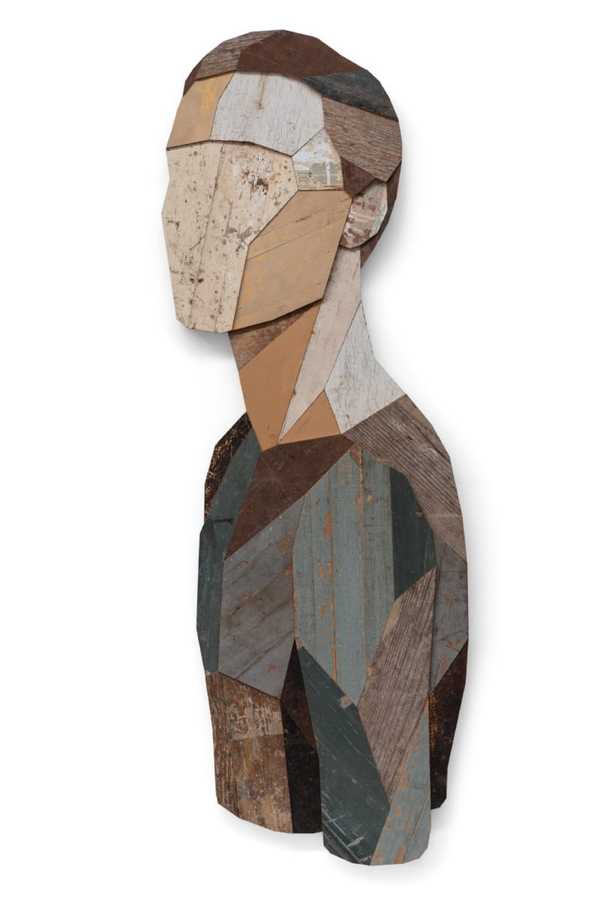 Wooden sculpture of a man looking towards