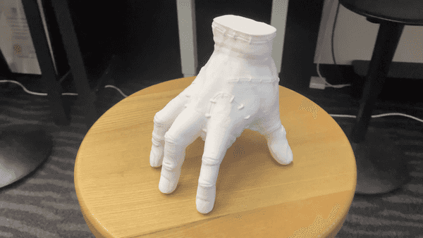 Creepy white hand sculpture