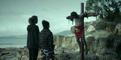 Man crucified with a chickenfeed shirt wrapped around his loins