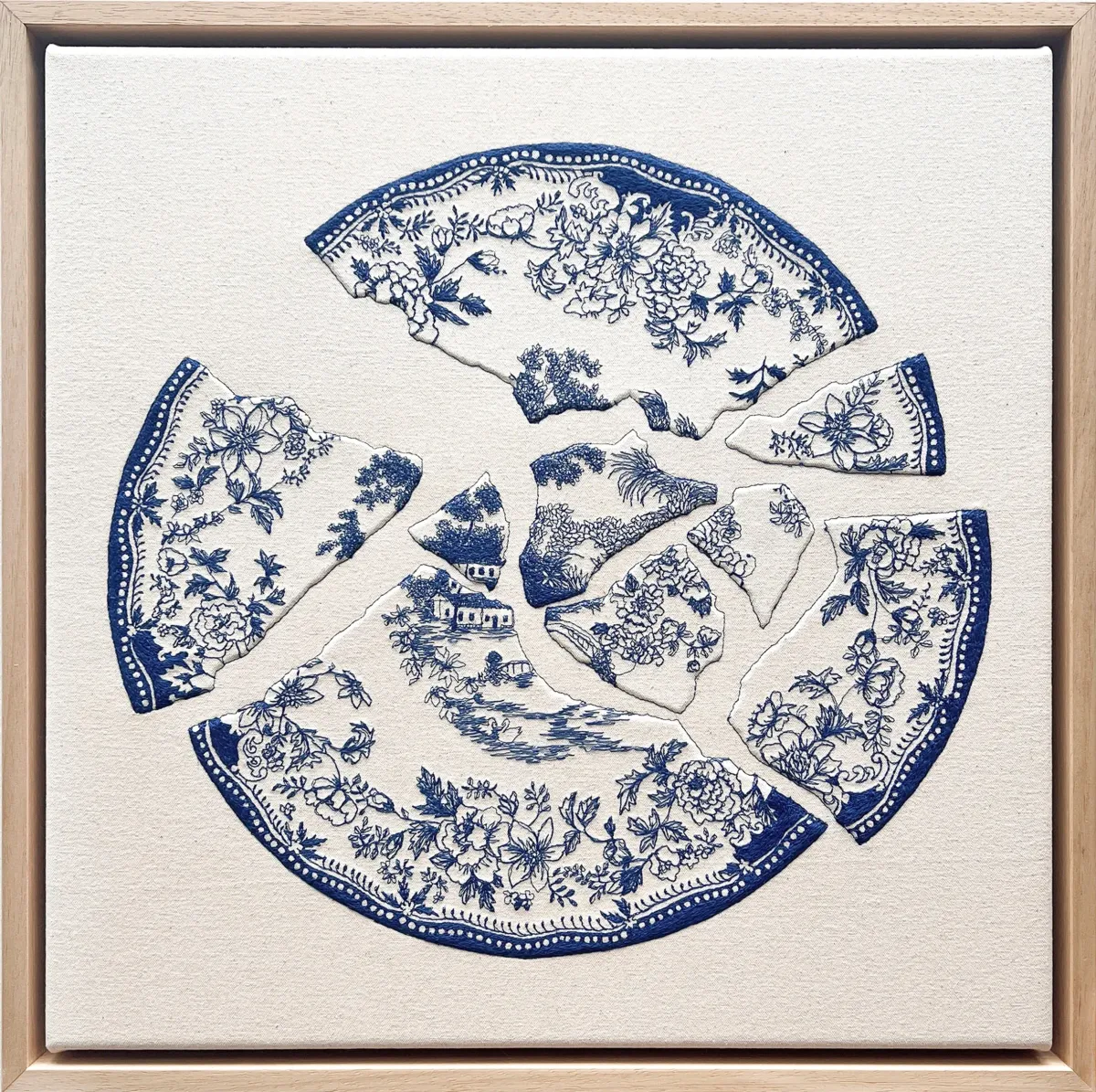 Photo of the embroidered artwork, depicting a broken plate