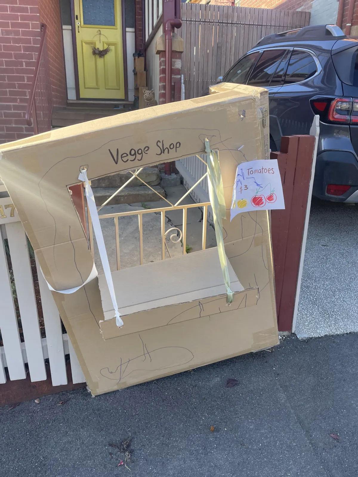 A kids Vegge Shop in a front yard