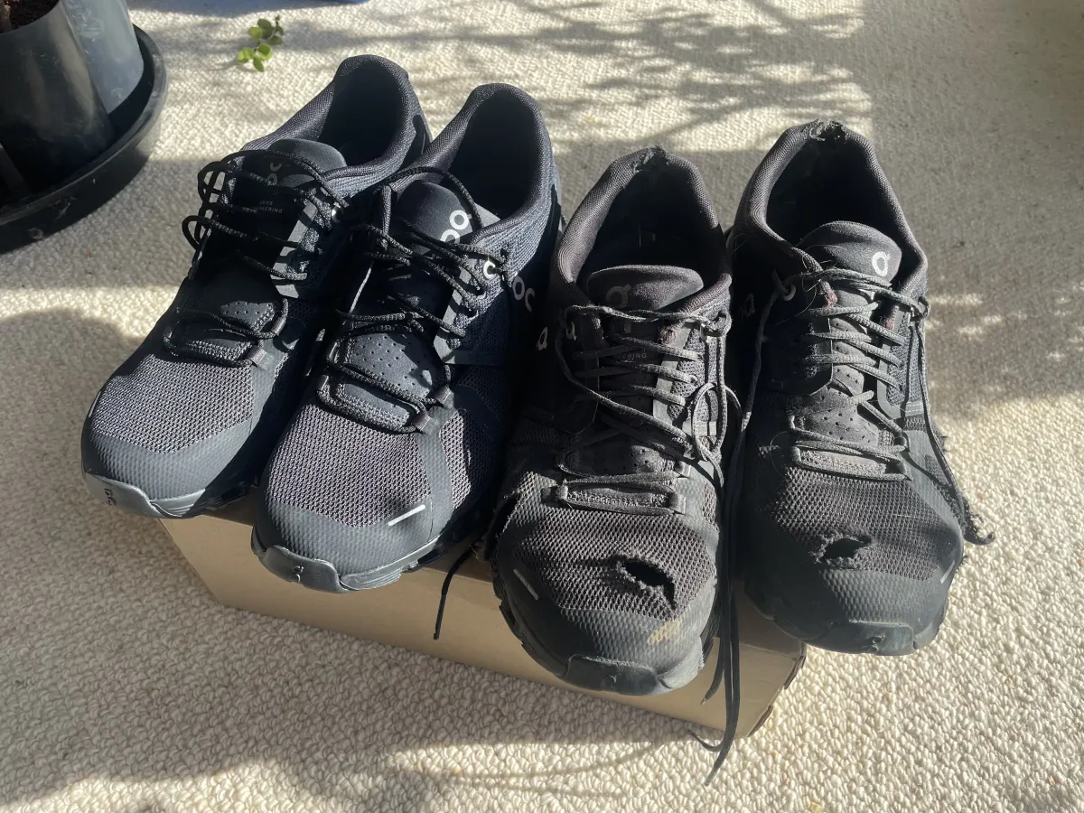 Old shoes next to new shoes